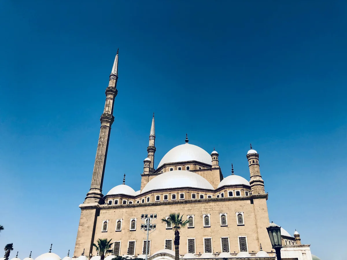 Muhammad Ali Mosque facade and minarets under a blue sky