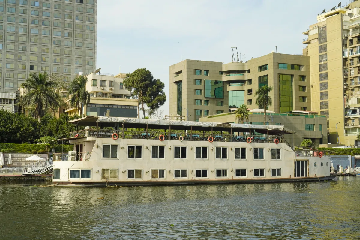 Nile dinner-cruise boat moored beside the Cairo riverbank